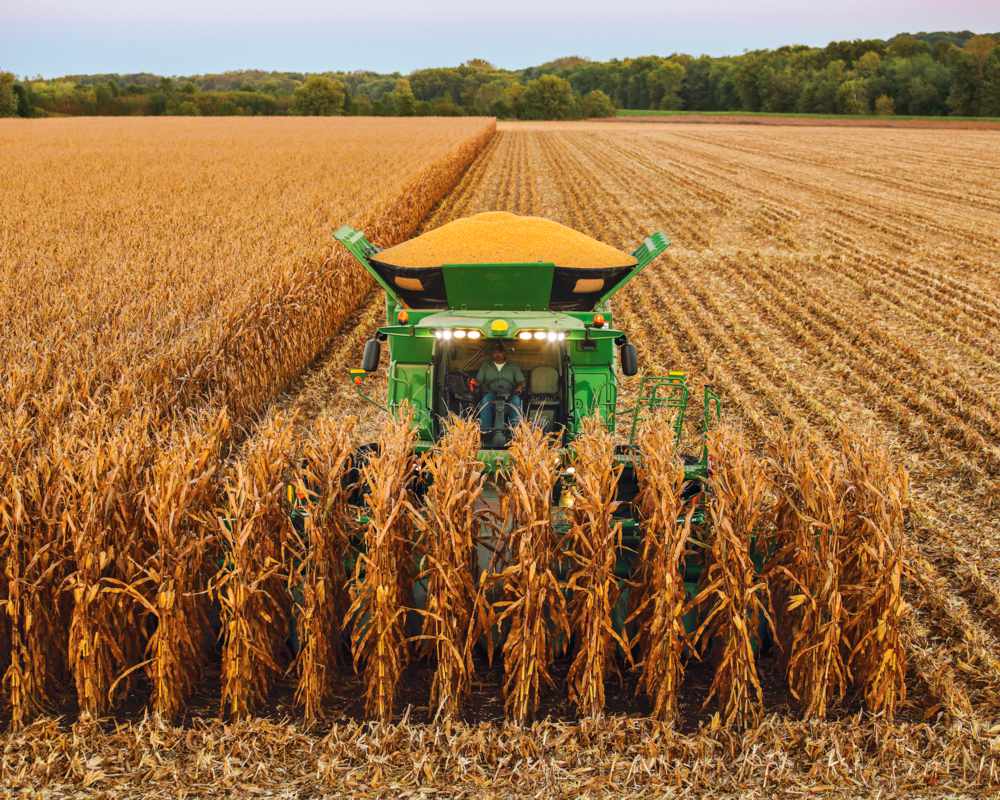 Corn harvest operations with equipment in field